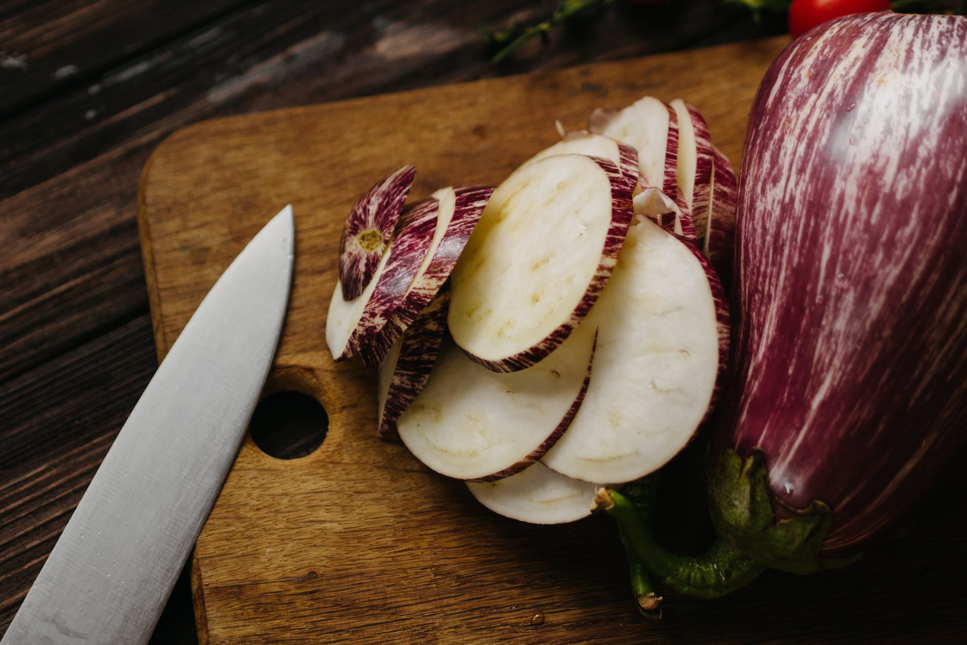 sliced fruit on brown wooden chopping board