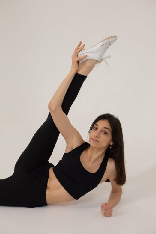 flexible woman doing exercise for stretching in studio