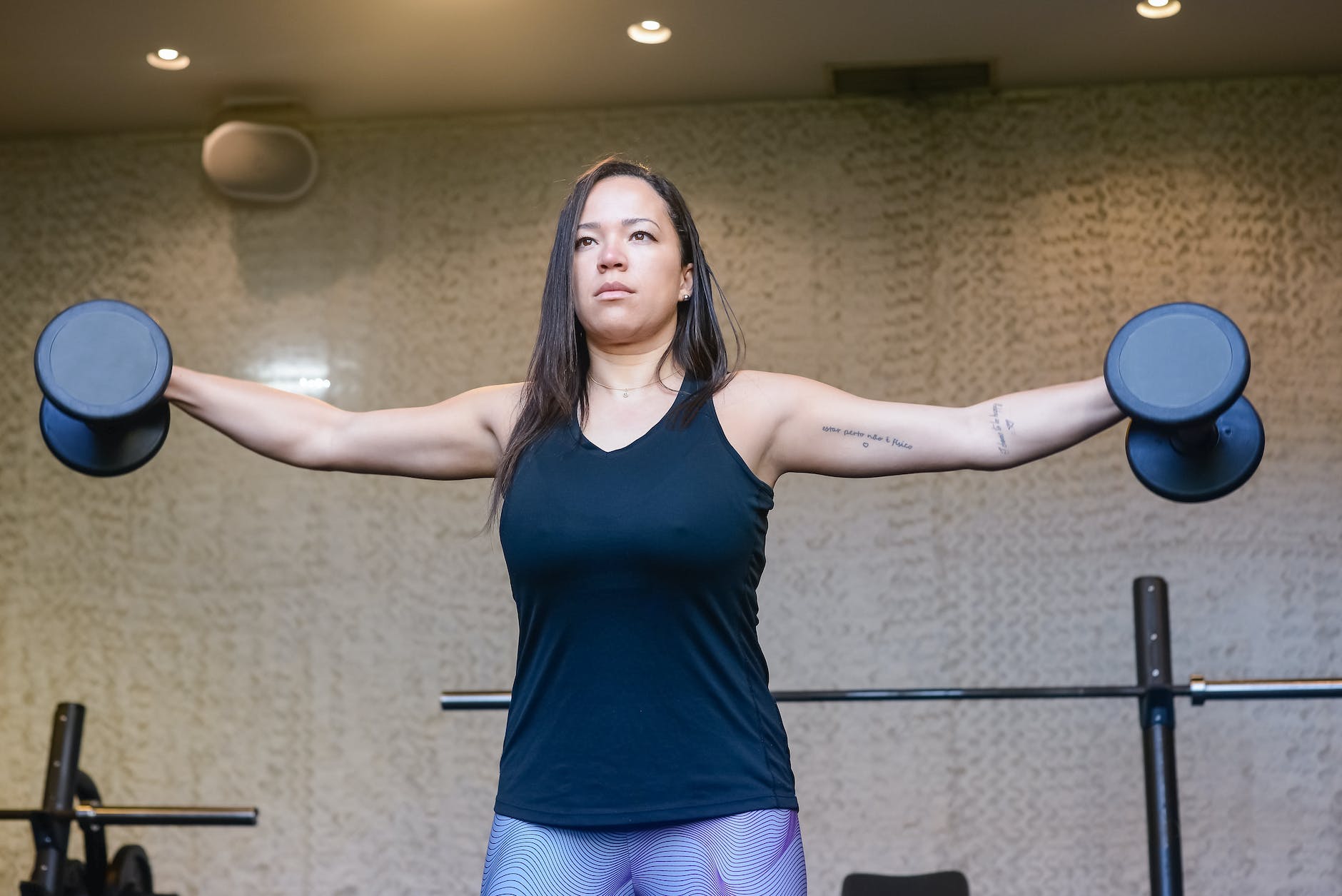 a woman lifting dumbbells