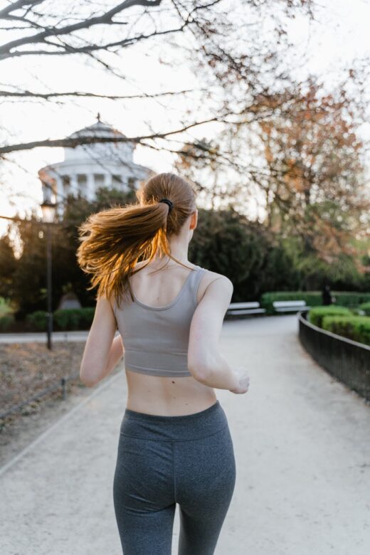 a woman running at the park