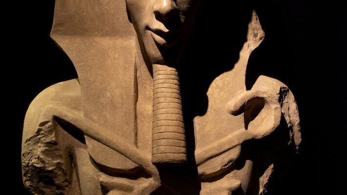 egyptian pharaoh figure in dark