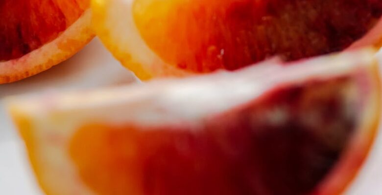 sliced orange fruit on white ceramic plate