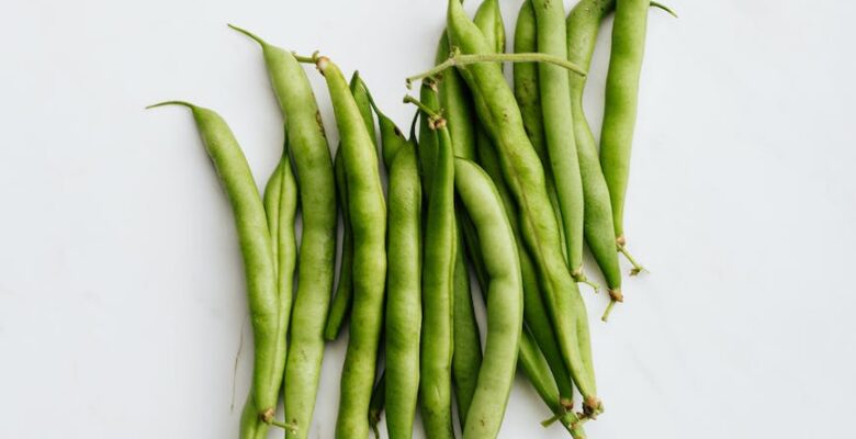 green peas on white surface