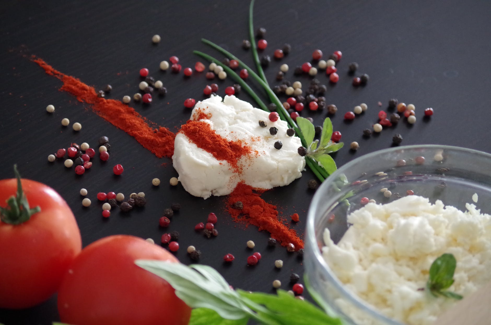 red tomato near white cream with spices