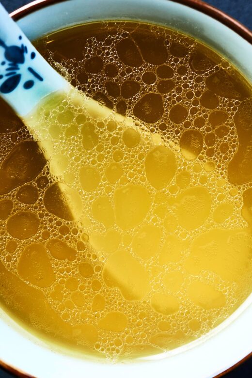 close up of a chicken soup in a bowl