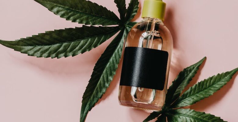 cbd oil on marijuana leaves