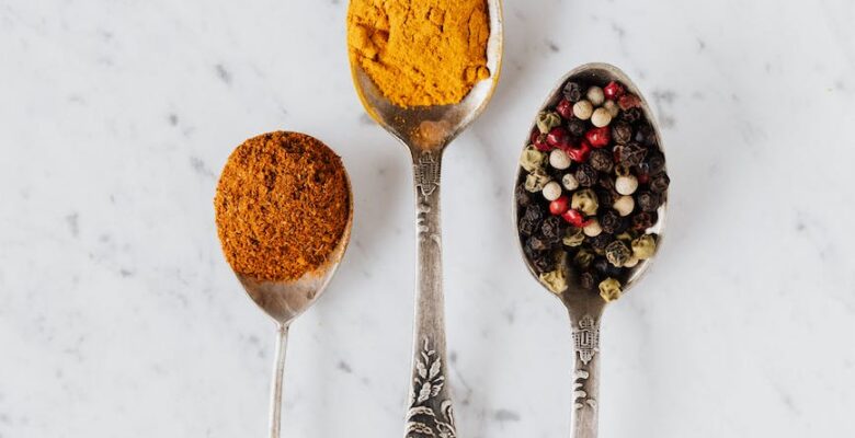 set of aromatic condiments in vintage spoons