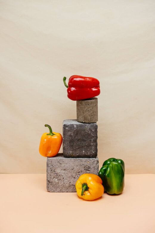 red bell pepper on the top of a concrete block