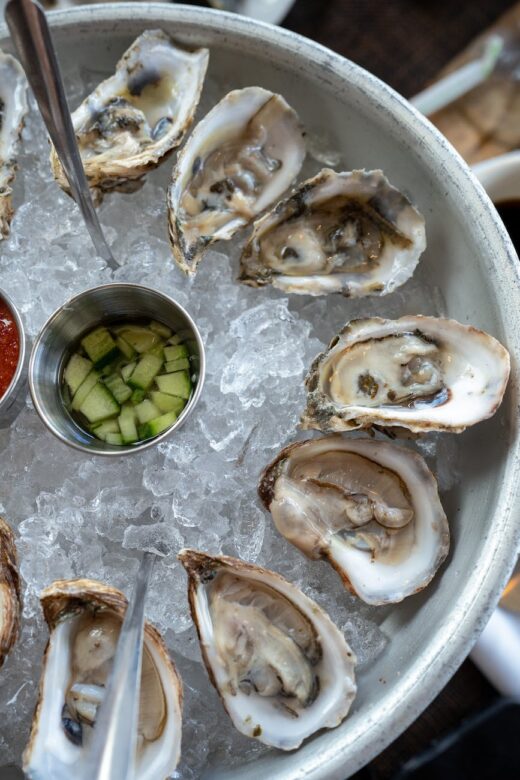 a crushed ice with oysters on top