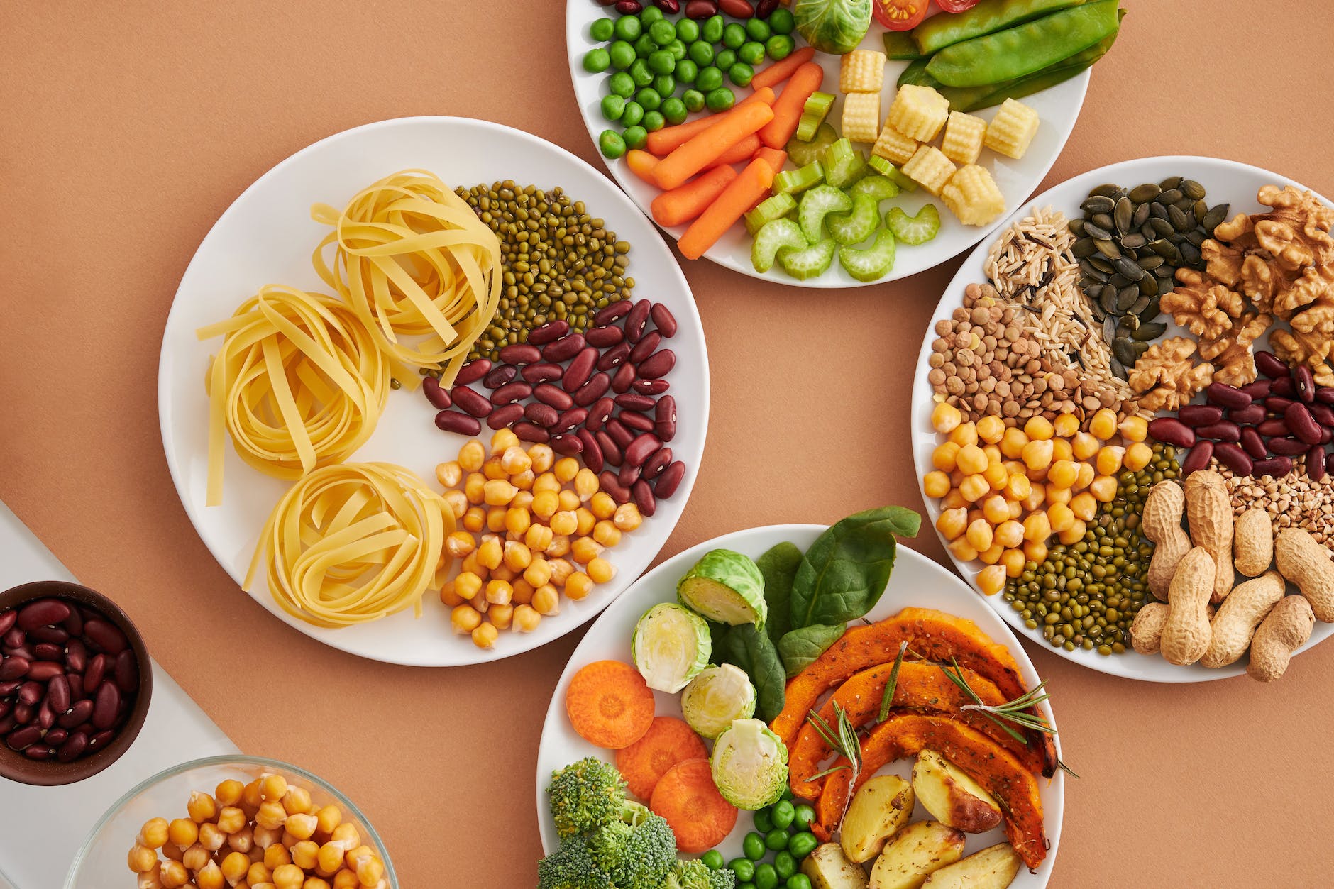 vegetables seeds and nuts on plates on table