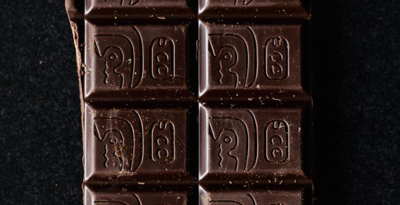 dark chocolate bar on black surface