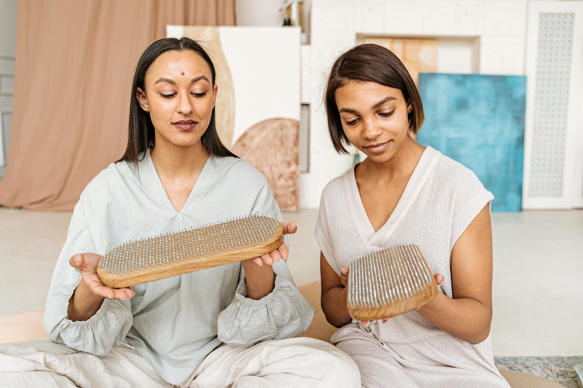 women holding sadhu boards