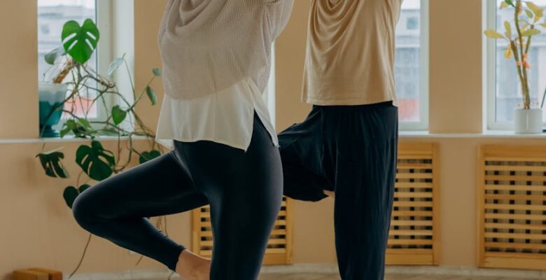 elderly couple standing on yoga mats